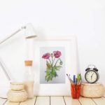 mockup-of-an-art-print-on-a-desk-next-to-a-lamp-3962-el1